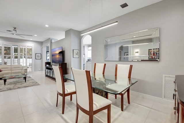 dining area with light tile patterned flooring and ceiling fan