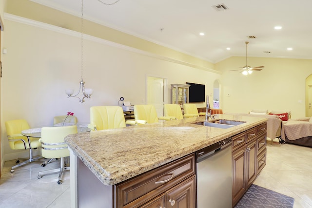 kitchen featuring dishwasher, lofted ceiling, a center island with sink, ceiling fan with notable chandelier, and sink