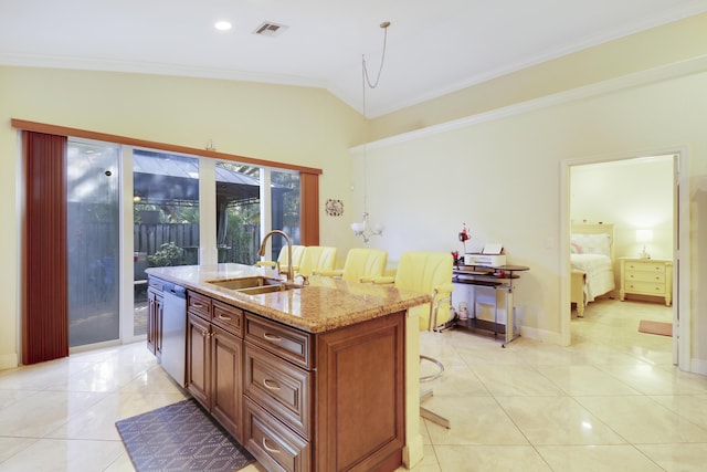 kitchen featuring sink, vaulted ceiling, stainless steel dishwasher, and an island with sink