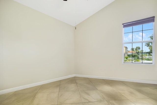 spare room featuring ceiling fan and light tile patterned floors