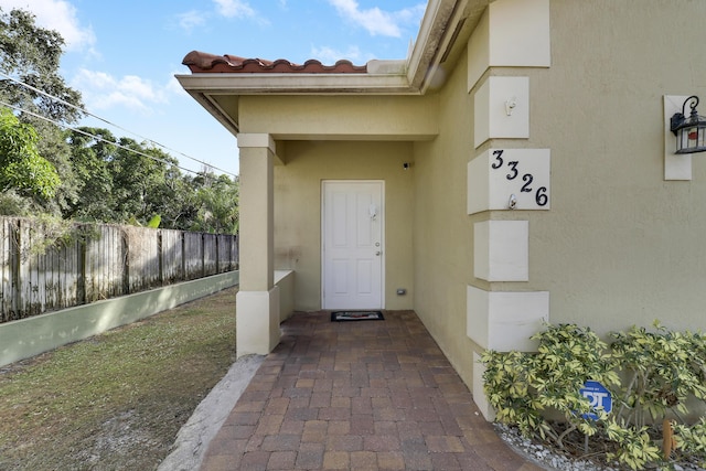 property entrance featuring a patio area