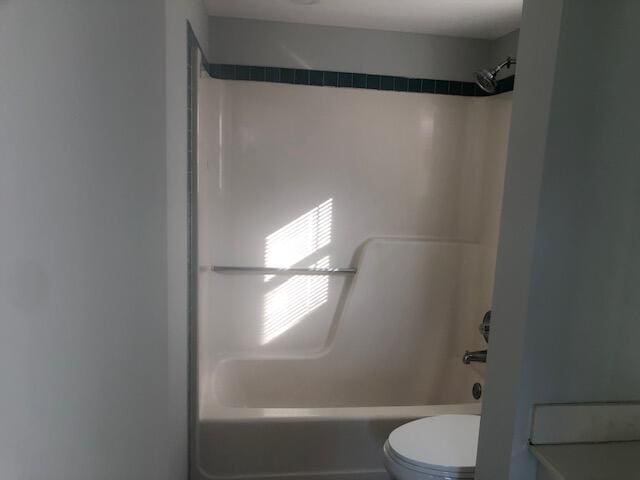 bathroom with  shower combination and toilet