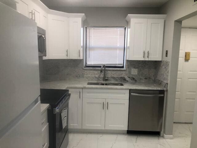 kitchen with white cabinetry, dishwasher, sink, black electric range, and white fridge