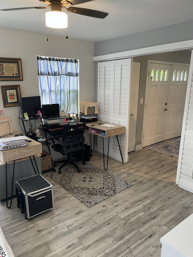 office area with ceiling fan and light wood-type flooring