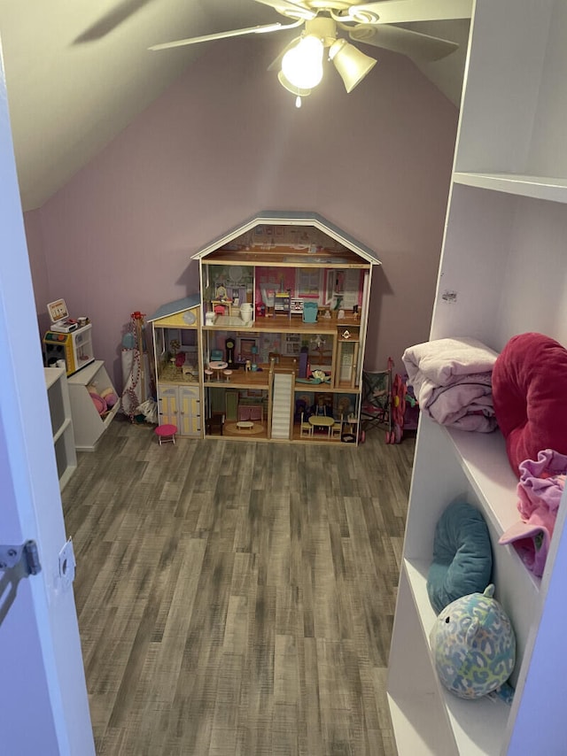 playroom with ceiling fan, wood-type flooring, and lofted ceiling