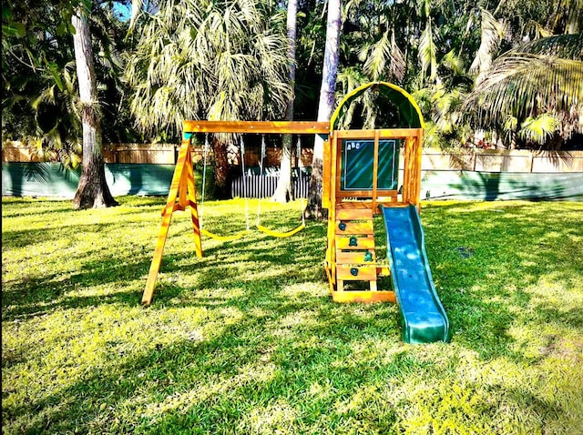 view of jungle gym with a lawn