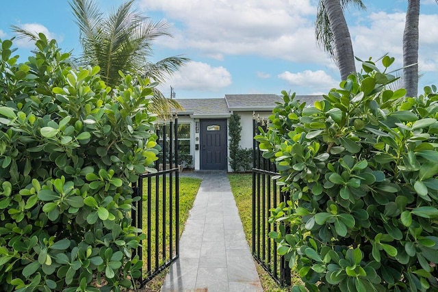 entrance to property with a yard