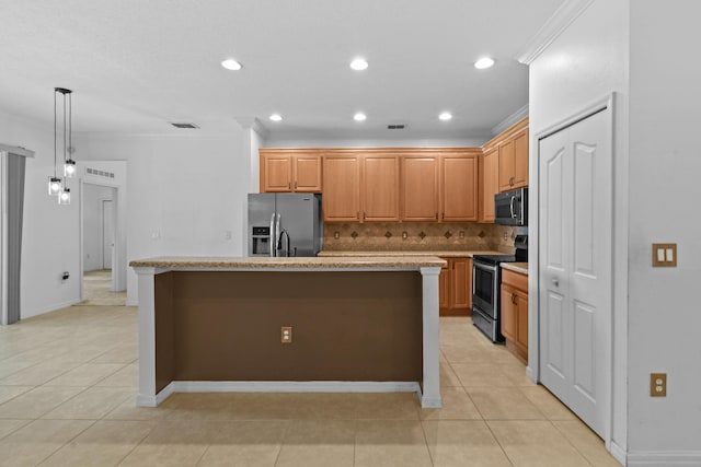 kitchen featuring light tile patterned floors, stainless steel appliances, a kitchen island with sink, and ornamental molding