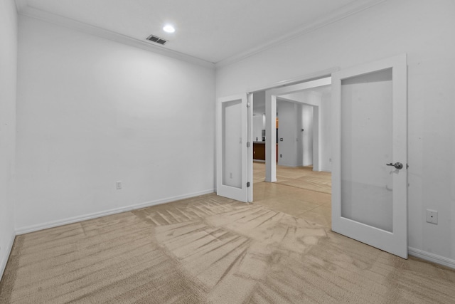 unfurnished room with light colored carpet and ornamental molding