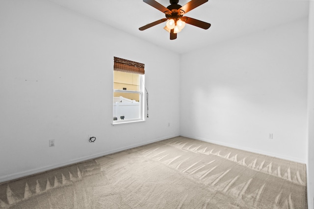 spare room featuring carpet flooring and ceiling fan