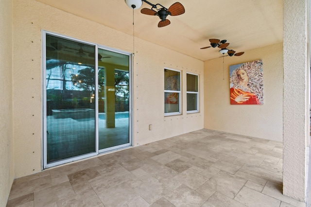 view of patio featuring ceiling fan