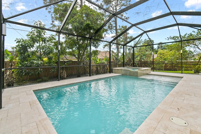 view of pool featuring a lanai, an in ground hot tub, and a patio