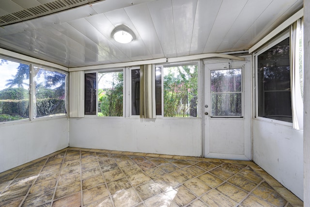 unfurnished sunroom with a healthy amount of sunlight