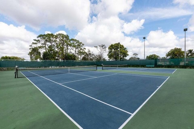 view of sport court with basketball hoop