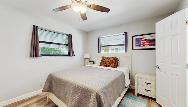 bedroom featuring ceiling fan and wood-type flooring