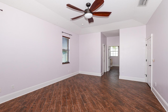 spare room with dark hardwood / wood-style floors and ceiling fan