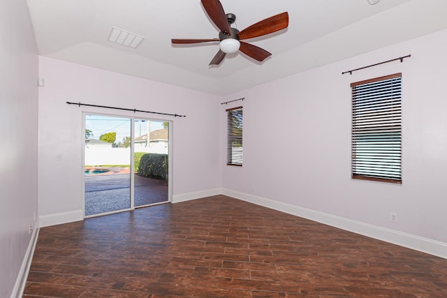 unfurnished room with dark hardwood / wood-style floors and ceiling fan