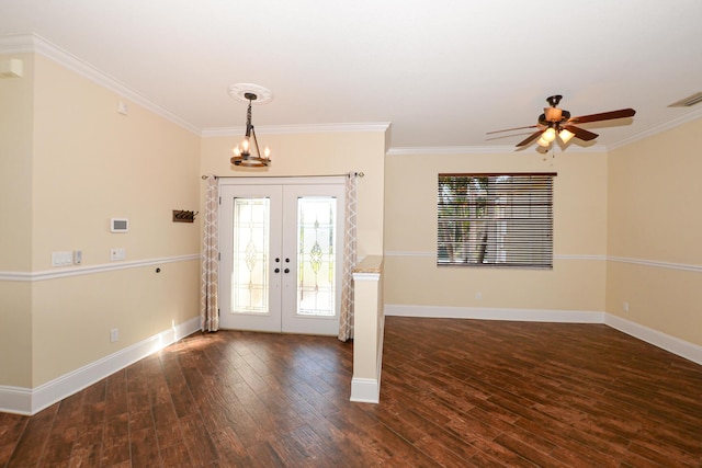 foyer featuring french doors, ceiling fan with notable chandelier, dark hardwood / wood-style flooring, and ornamental molding