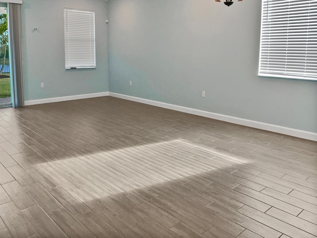 unfurnished room with light hardwood / wood-style flooring