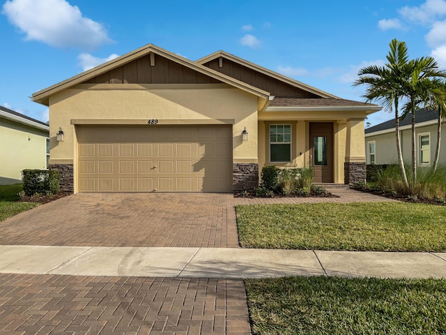 craftsman inspired home with a garage