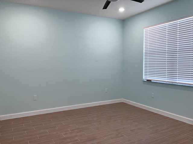 unfurnished room featuring ceiling fan and wood-type flooring