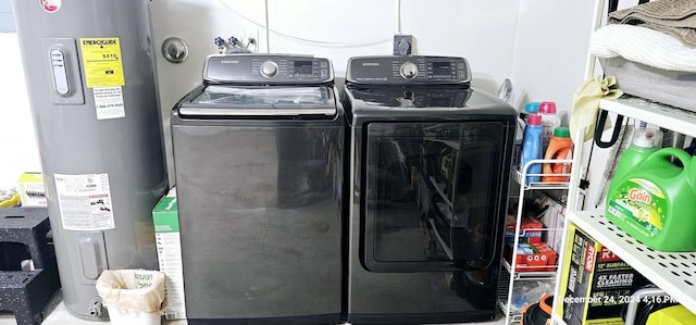 washroom featuring independent washer and dryer and electric water heater