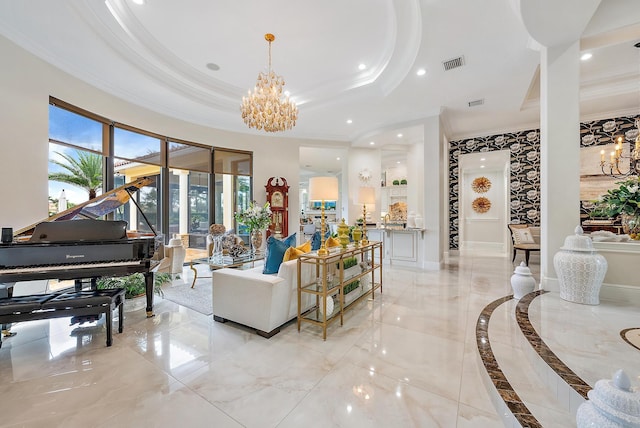 living room with a tray ceiling, ornamental molding, and an inviting chandelier