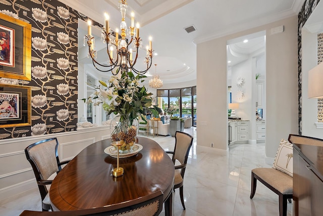 dining room with a notable chandelier and ornamental molding