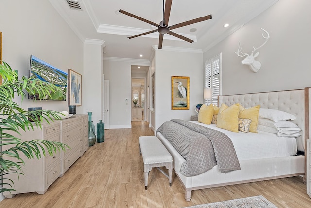 bedroom with ceiling fan, ornamental molding, and light hardwood / wood-style flooring