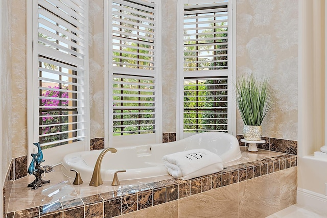 bathroom with tiled bath