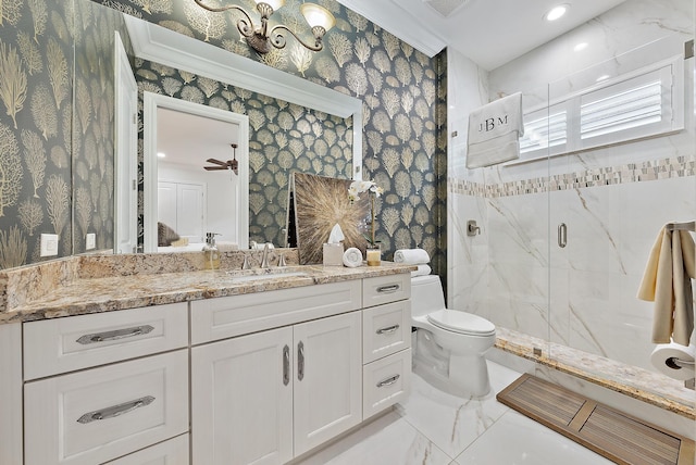 bathroom featuring ceiling fan, walk in shower, crown molding, toilet, and vanity