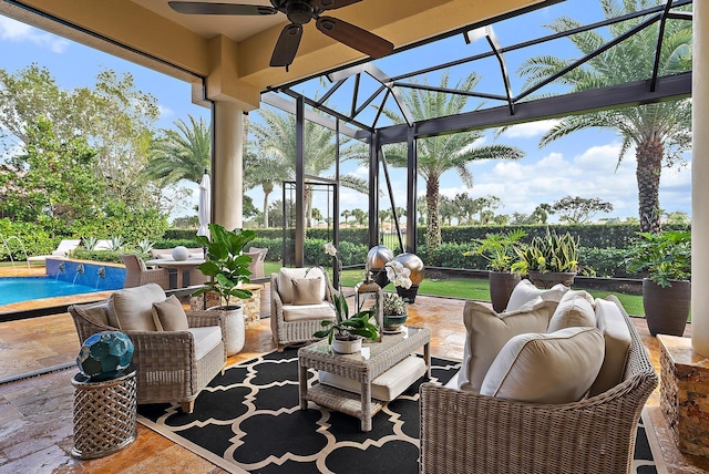 view of patio / terrace featuring glass enclosure, ceiling fan, and an outdoor hangout area