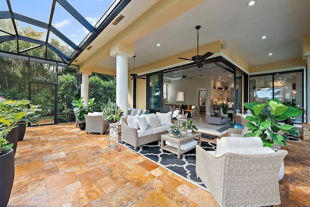 view of patio / terrace featuring an outdoor hangout area, glass enclosure, and ceiling fan