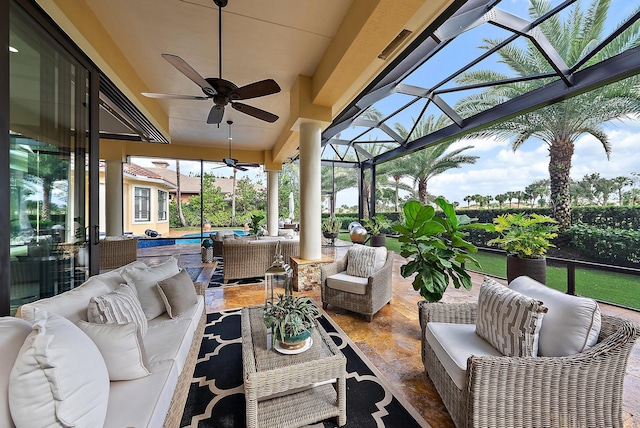 sunroom featuring ceiling fan