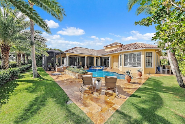 view of pool featuring a lawn, a patio area, a sunroom, and an in ground hot tub