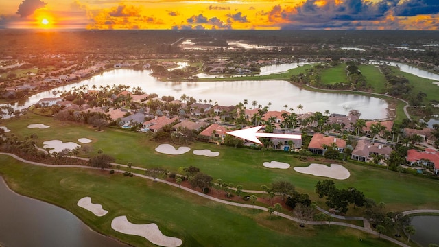 aerial view at dusk with a water view