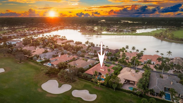 aerial view at dusk with a water view