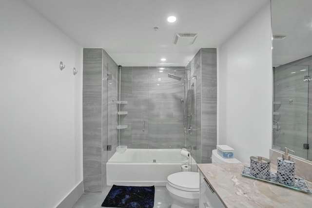 full bathroom with vanity, combined bath / shower with glass door, and toilet