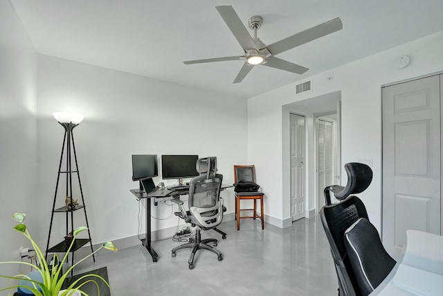 office area featuring ceiling fan and concrete floors