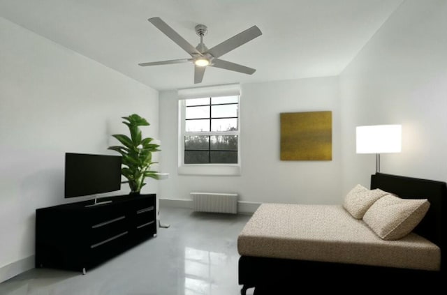 bedroom with radiator and ceiling fan