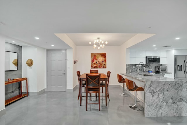 dining room featuring an inviting chandelier