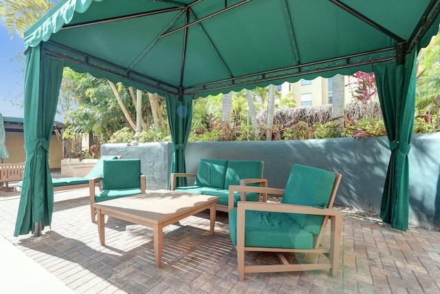 view of patio with a gazebo and outdoor lounge area