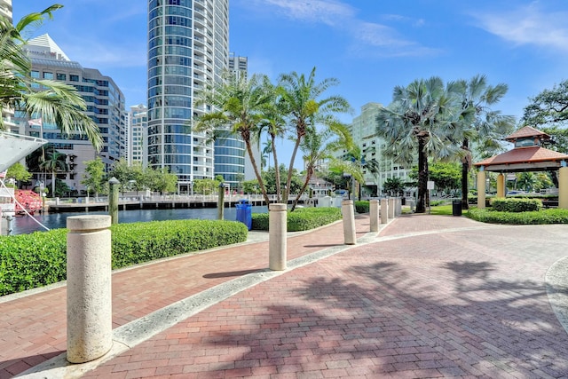 view of community with a gazebo and a water view