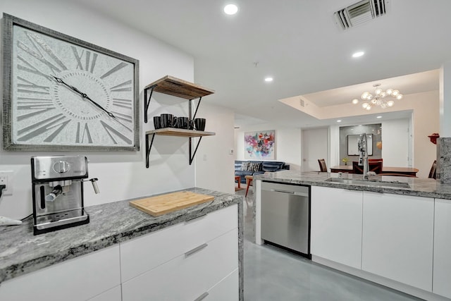 kitchen with sink, dishwasher, white cabinets, and stone counters