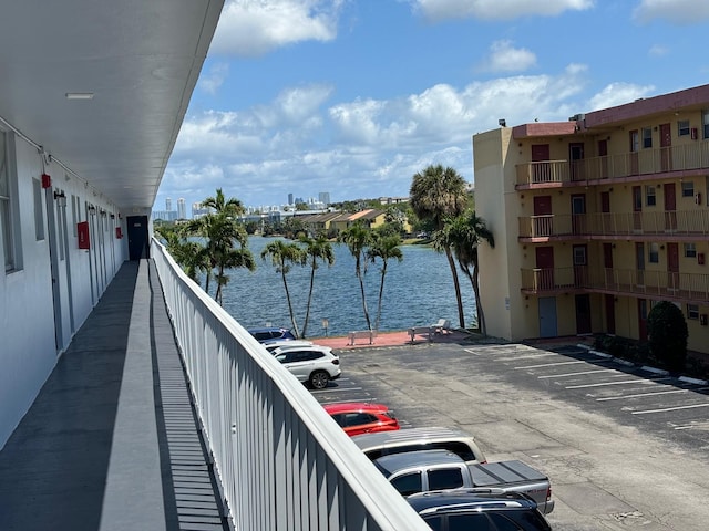 balcony featuring a water view