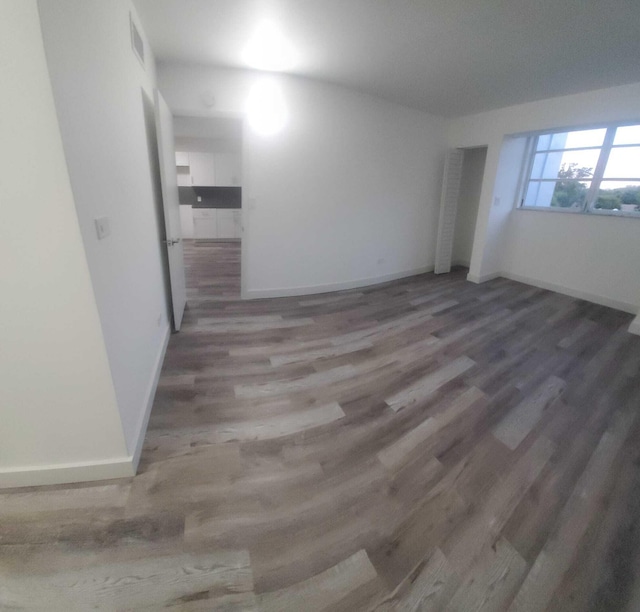 spare room featuring hardwood / wood-style floors