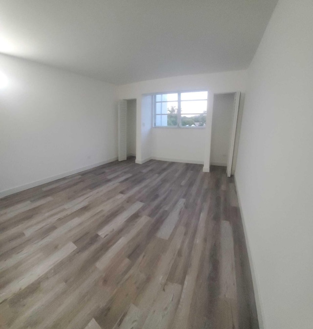 unfurnished room featuring wood-type flooring