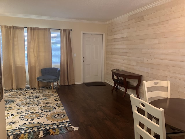 living area featuring dark hardwood / wood-style floors, ornamental molding, and wooden walls