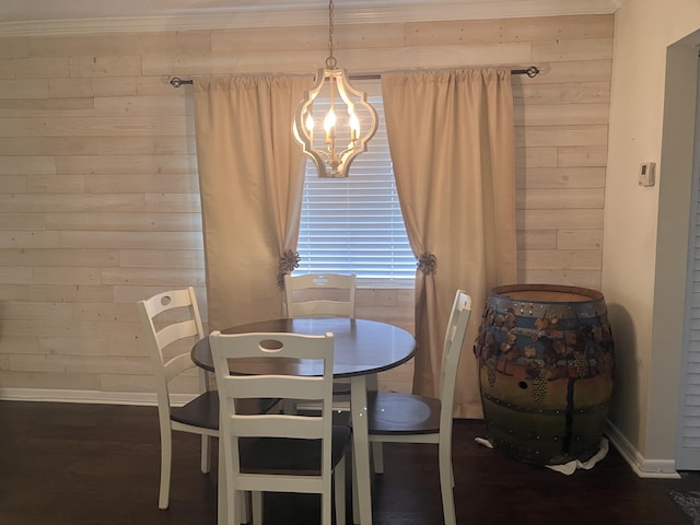 dining space featuring wood walls and dark wood-type flooring