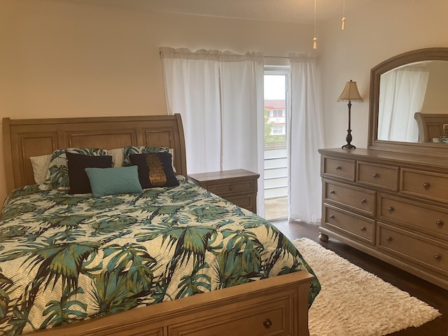 bedroom with dark wood-type flooring